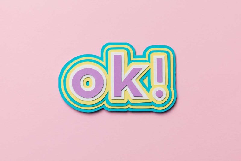 "ok!" on a pink pastel background
