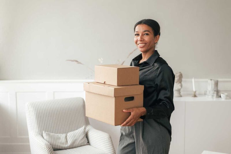 A young woman getting ready to move into her new home.